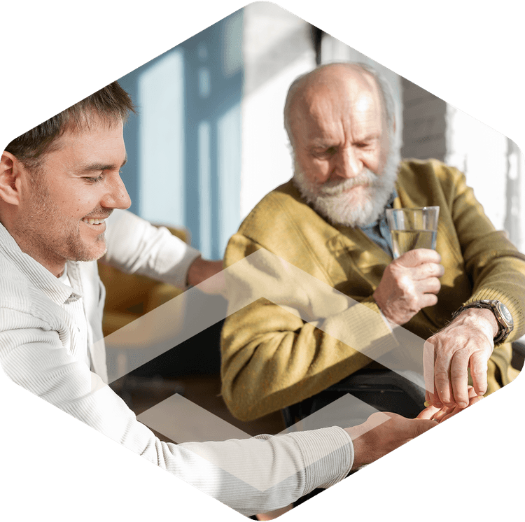 Nurse and elderly resident smiling together