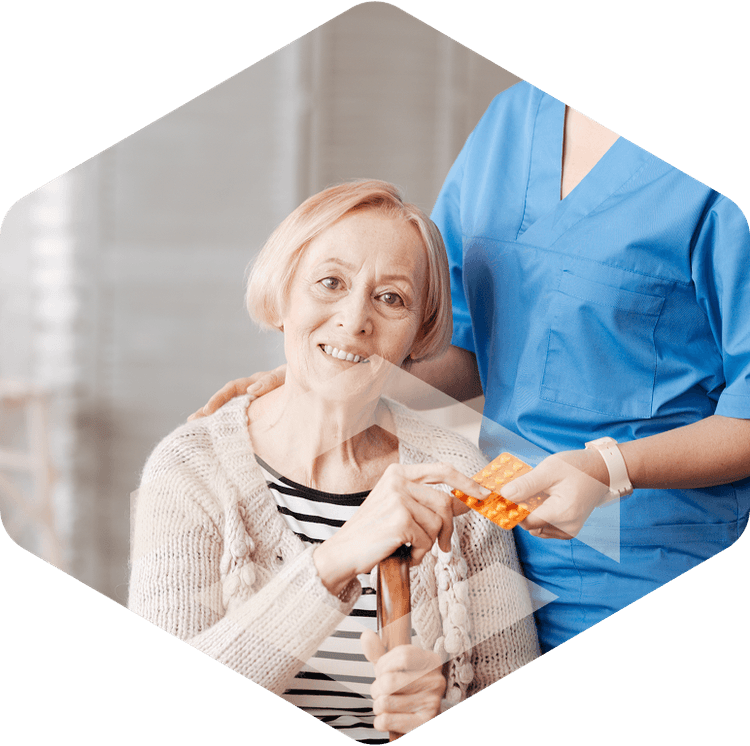 Caregiver supporting an elderly woman during respite care